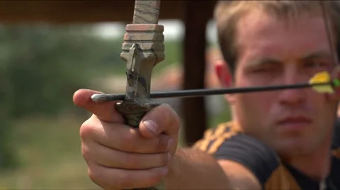 Man shoots a bow at a target, Slow Motion 3 Stock-Footage 27551141