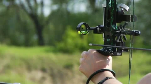 Man shoots a crossbow Stock Footage 10915320