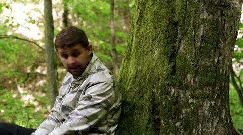 Man shoots a gun in the forest. shoot from the enemies. shooting training. Stock Footage 62678782