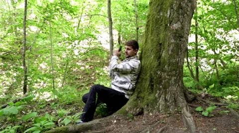 Man shoots a gun in the forest.shooting training. sniper. self-defense. Stock Footage 62681414