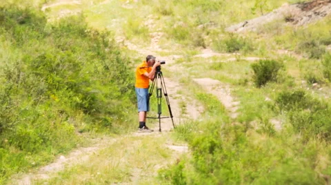 Man shoots landscape Stock Footage 48847841
