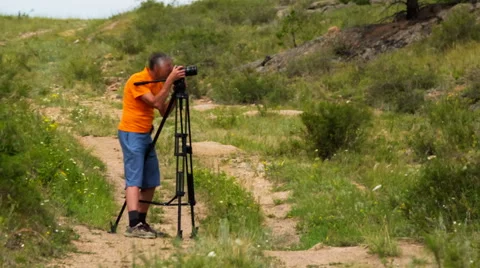 Man shoots landscape Stock Footage 48847852