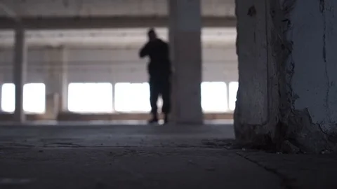 A man shoots a pistol 库存影片 75334024