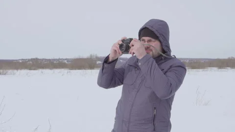 A man shoots on a retro camera 4K Stock Footage 95230811