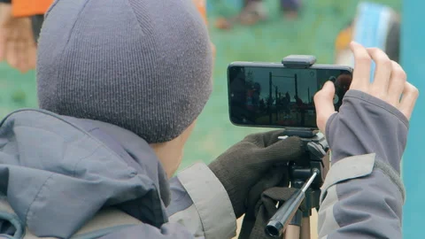 A man shoots video on a smartphone Stock Footage 109246762