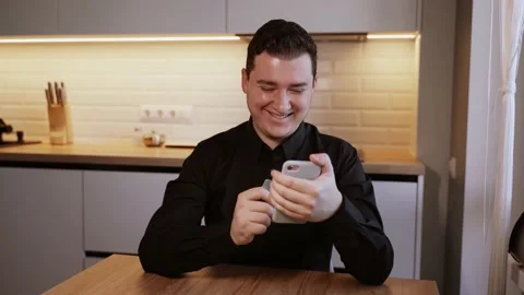 Man shopping with credit card using smartphone at home. He happy about purchase Stock Footage 149692873