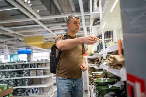 Man shopping for kitchenware in store Stock Photos