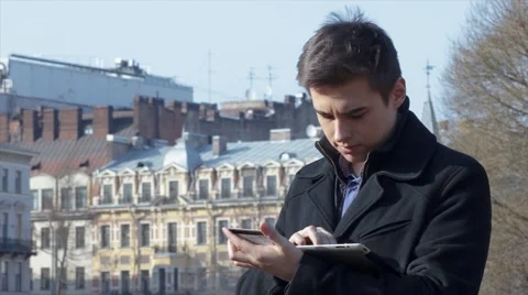 Man shopping online using tablet and credit card outside Stock Footage 61865280