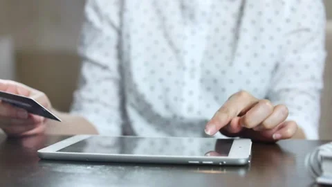 Man shopping online using tablet home tab and credit card Smiling customer Stock Footage 265930371