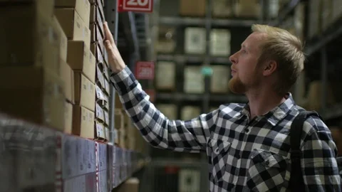 The man is shopping at the warehouse store Stock Footage 91153872