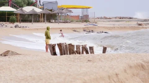 Man on the shore of an empty beach Stock Footage 77567141