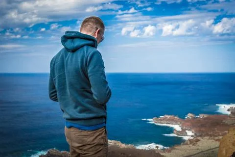Man on the shore. Stock Photos