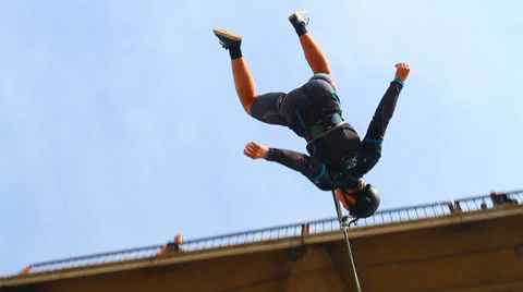 Man in shorts jumping bridge Stock Footage 37220438