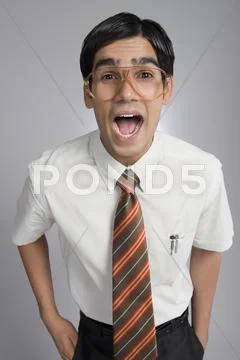 Man shouting with his hands in his pockets Stock Photos