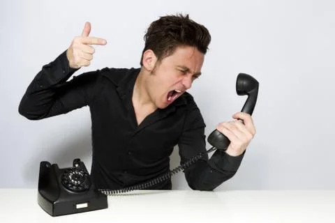 Man shouting on the phone Stock Photos