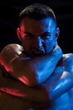 Man shouting while covering chest and neck with crossed arms Stock Photos