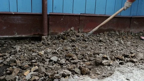 Man is shoveling stones Stock-Footage 80288338