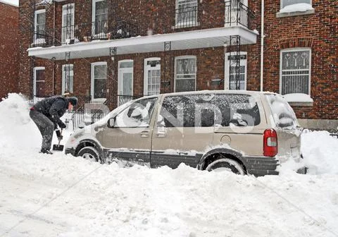 Man shovelling after a snow storm Stock Photos