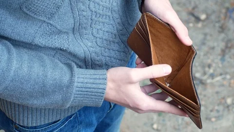 Man show empty wallet and go away Stock Footage 116730631