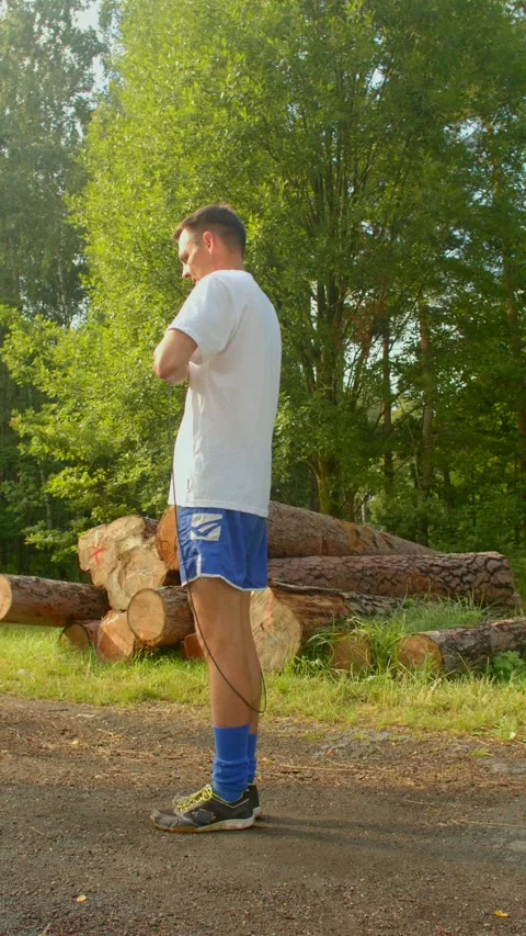 A man showcases various activities in a serene woodland setting Stock Footage 314346348