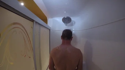 Man in shower soaking his head gopro 4k Stock Footage 76111714