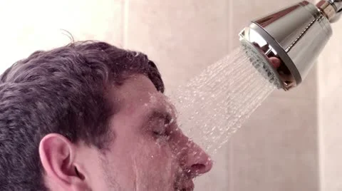 Man in shower with water on face 스톡 동영상 11982171