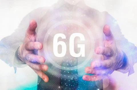 Man is showing 6G network interface symbol between his hands Stock Photos