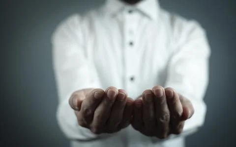 Man showing empty opened hands. Stock Photos