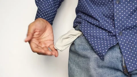 Man showing empty pockets, financial crisis, poverty and no money close up .. Stock Footage 332626258