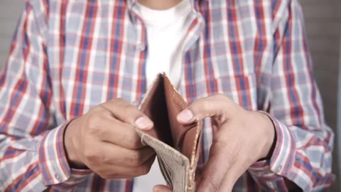 Man showing empty wallet with no money struggling with financial problems c.. Stock Footage 332475003