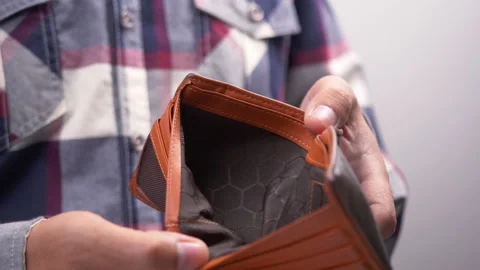 Man showing empty wallet. Poverty finance business bankruptcy and debt concept. Stock Footage 137216787