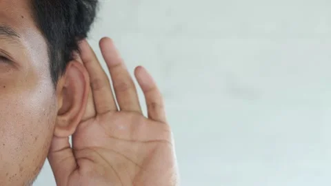 Man showing hand to ear gesture on white background, closeup. Space for text Video stock 327649570