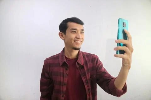A man showing happy expression during video call Stock Photos