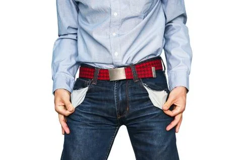 Man showing his empty pockets demonstrating he has no money Foto stock