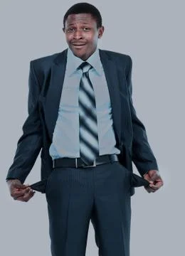 Man showing his empty pockets Stock Photos