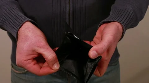 Man showing his empty wallet Stock Footage 10682014