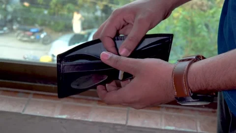 A Man Showing His Empty Wallet, Lack of Money, Financial Bad Condition, Poverty Stock Footage 293681821