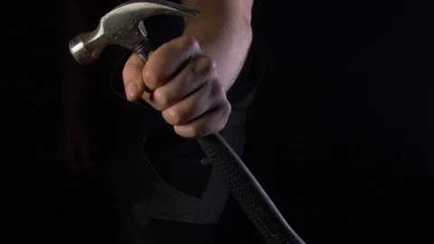 Man Showing His Hammer In A Smokey Dusky Room Stock Footage 123711074