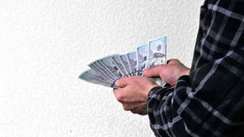 Man Showing Large Stack of Hundred Dollar Bills, Close Up Cash Money Stock Footage 346058401