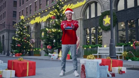 Man Showing A Present And Smiling To The Camera In Christmas Night Stock Footage 278412173