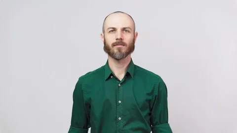 Man showing refusal gesture no, shaking his head and finger. Serious bearded man Stock Footage 126663616