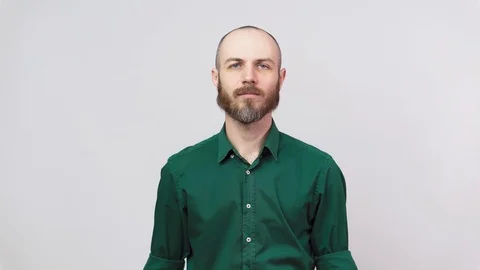 Man showing refusal gesture no. Serious bearded man is gesturing negatively Stockbeeldmateriaal 126663701