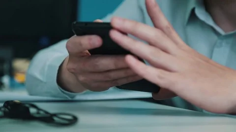 A man is showing a smartphone Stock Footage 75950334