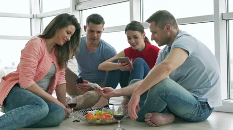Man showing something on cellphone to his friends Stock-Footage 50565324