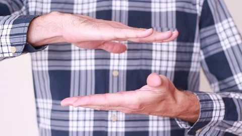 Man showing something medium in size Видео 94137804