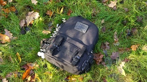 Man showing Survival Backpack in Forest Nature Stock Footage 111856378