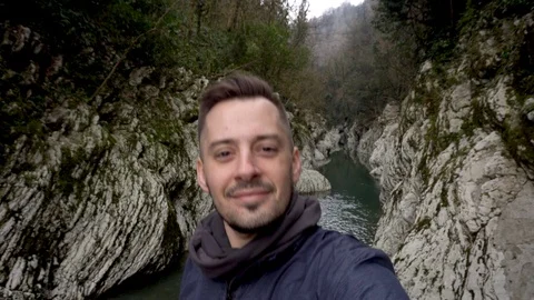 Man showing thumb up at Canyon Devil's Gate in Sochi, Russia. Stock Footage 111178514