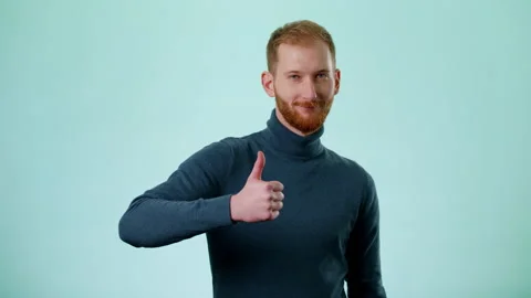 Man Showing Thumbs Up Smiles To Camera, Demonstrating Approval, Showing Ok Stock Footage 170189498