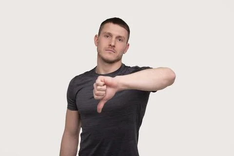 Man Showing Thump Down Isolated. Sportsman Thumb Down Stock Photos
