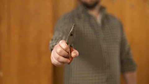 Man showing work tools Stock Footage 120997398